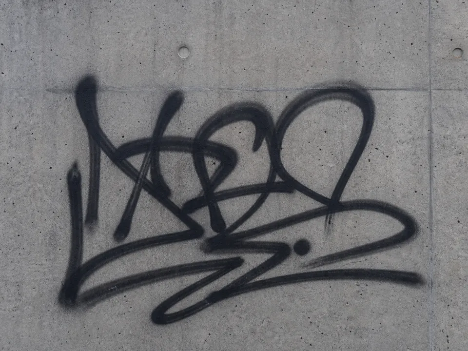 Concrete wall before graffiti removal